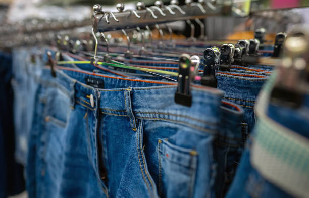 istock Rack with jeans in clothing store. 1711740205