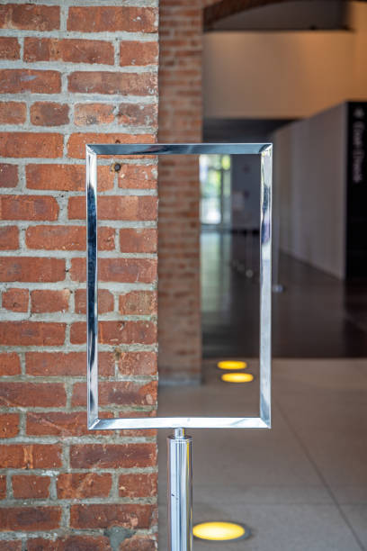 Empty poster holder in front of a brownstone wall