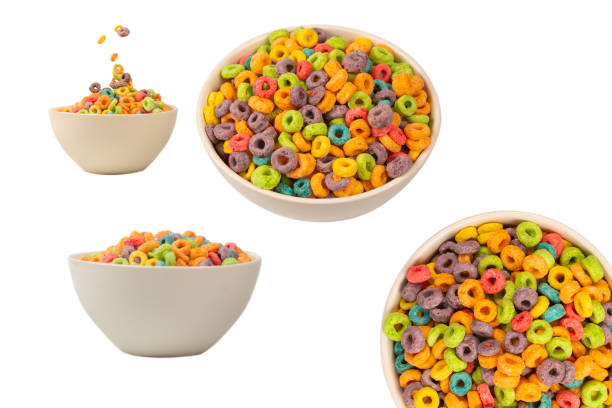 istock Colorful cereal box for morning breakfast. Corn flakes falling to the white bowl. Motion. 1711754476