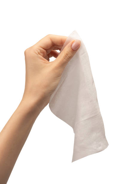 istock Wet wipe in a woman hand isolated on a white background. 1711754906
