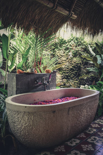 istock Bath tub with flower petals 1711758476