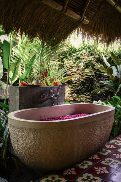 istock Bath tub with flower petals 1711758481