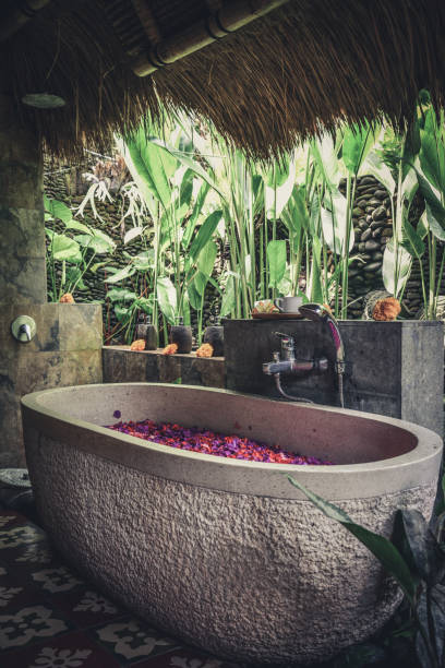 istock Bath tub with flower petals 1711758588