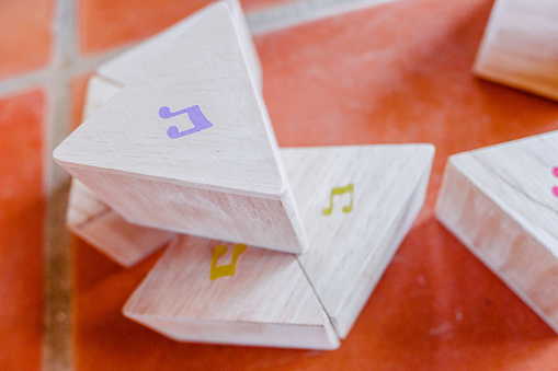 Wooden block with musical notes to learn children music theory.
