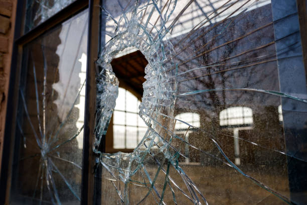 istock Window with a broken glass in a disused old factory. 1711789571