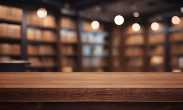 istock Beautiful natural wooden table with library background 1711790521