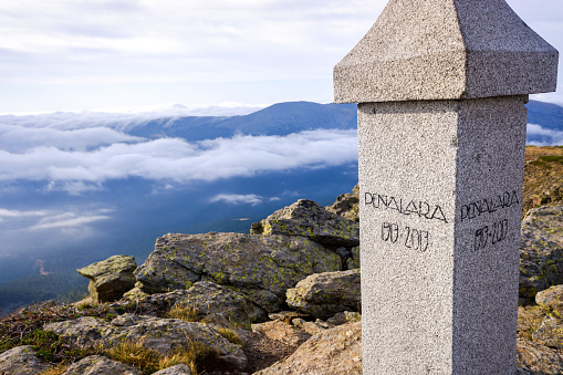 Stone post with the name of the top of the mountain of Peñalara, Madrid.