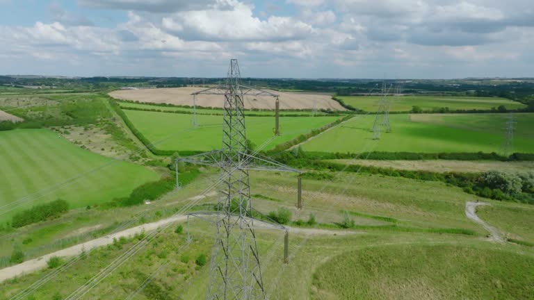 Electric high voltage tower with electric line at suburb in England