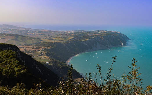 View from above of the Conero Riviera (Marche, Italy) and its beaches. View of Portonovo beach.