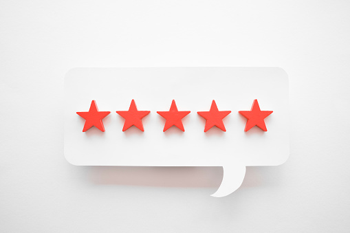 Five star rating feedback with speech balloon.