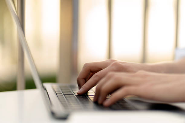 istock Copywriter hand typing on keyboard, working online, selective focus. Business woman using laptop 1711856567