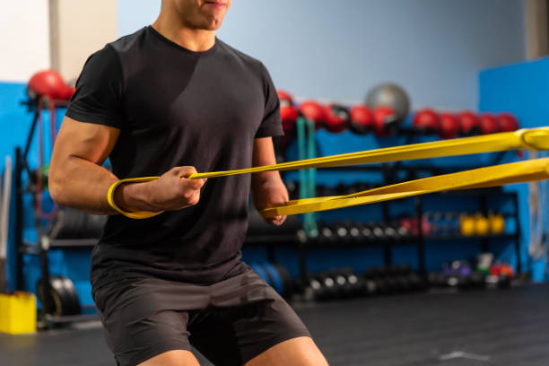 istock Unrecognizable sportive man with an arm amputated training in a gym 1711857715