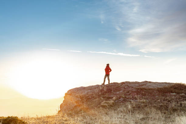istock Female hiker standing on top of mountain 1711862875