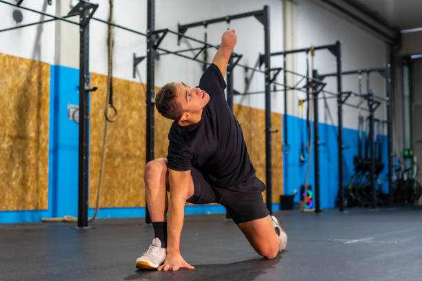 istock Man with an arm amputated stretching in a gym 1711863223