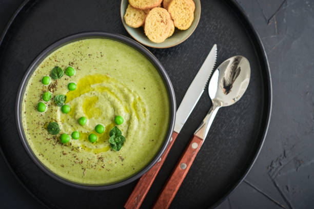 istock Green pea soup with croutons 1711877811