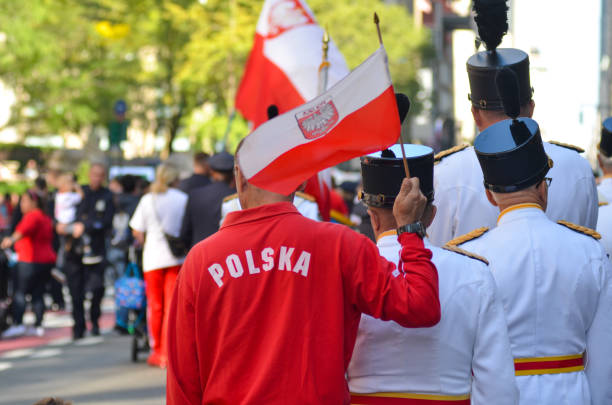 A man is wearing Polska Tshirt in the 86th Annual Pulaski Day Parade along Fifth Avenue, New York City.