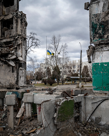 A Ukraine flag flies in the city of Borodianka, near Kyiv. Many buildings were damaged in 2022 during the Russian attack on the city.