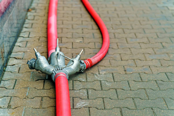red fire hose sidewalk distance, branching into two