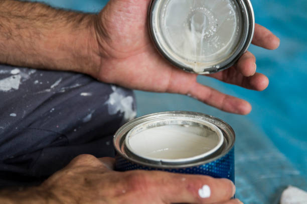 istock Wall Painter Opening The Cap Of Can 1711944376