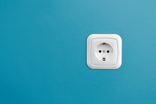 Blue wall with european socket