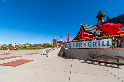 General view of the Buoy Bar and Grill, lakefront restaurant in the public boardwalk alongside McEuen Park and the landmark CDA Resort along the lake in Coeur d'Alene Idaho.