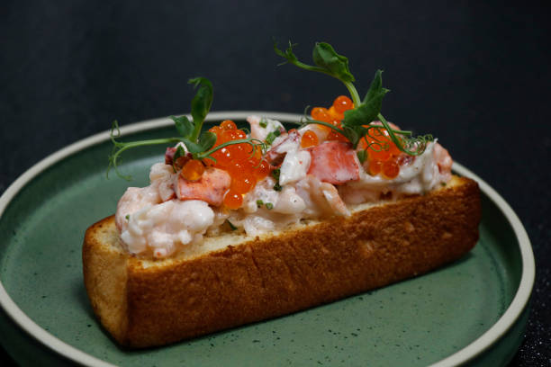 istock lobster roll open face sandwich in plate with black background 1712044608