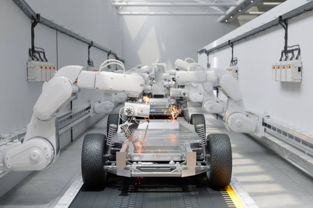 vista frontale dei bracci del robot che assemblano le auto nella fabbrica dell'automobile - industria dellautomobile foto e immagini stock