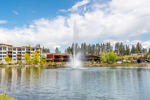 The small lake in the work, live and play community of Riverstone in the downtown district of Coeur d'Alene, Idaho, in the Idaho panhandle. Riverstone is an open-air lifestyle shopping destination with condominiums, hotels, shopping, restaurants and a movie theater.  Therre is also a 10 acre park with water fountain.