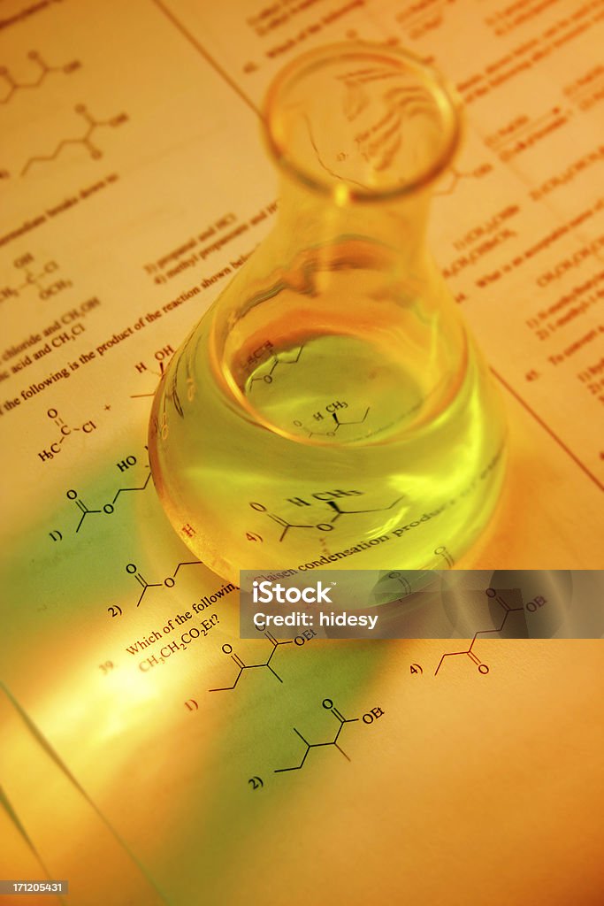 Testing Beaker on a multiple choice chemistry quiz.  Shallow depth of field Scientific Experiment Stock Photo