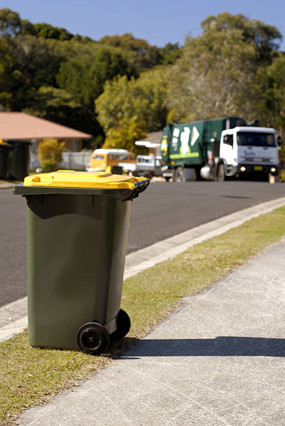 Focus on Rubbish bin with rubbish truck approachingSimilar image: