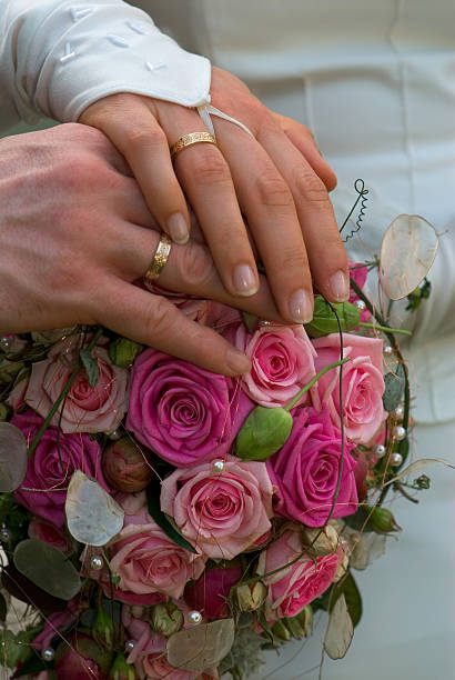istock wedding bands: close up of hands 171205915