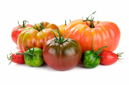 Delicious and beautiful organic heirloom tomatoes.  Shallow dof.