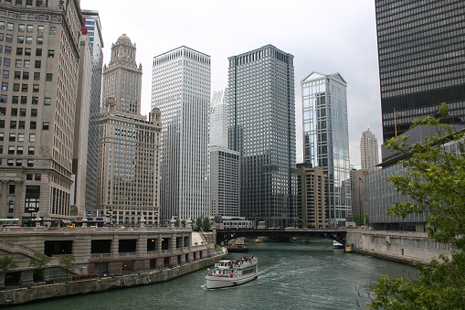 Downtown Chicago, Illinois with a tourist boat on the Chicago river
