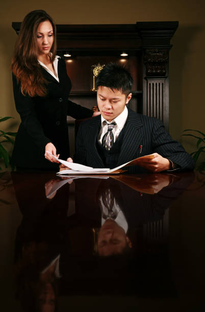 Young Business People Two young business people in a conference room modelkt stock pictures, royalty-free photos & images