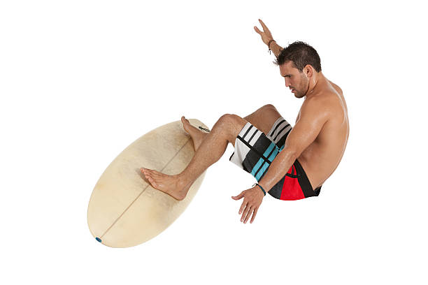 Man surfing on a surfboard Man surfing on a surfboardhttp://www.twodozendesign.info/i/1.png unbalance stock pictures, royalty-free photos & images