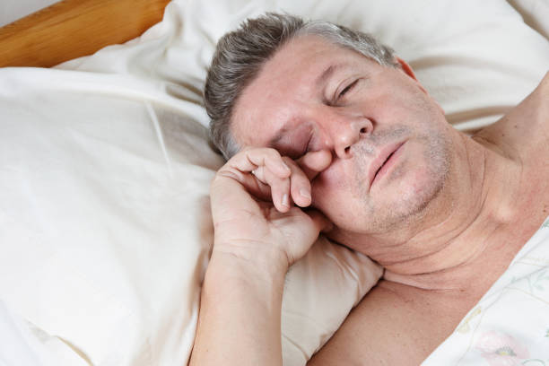 istock Mature man half asleep in bed 171206733