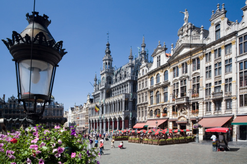 Street and roundabout Place Colignon in Brussels Schaerbeek. Capture is near local town hall. Old fin de siecle buildings are in this district. Cars are parked in street