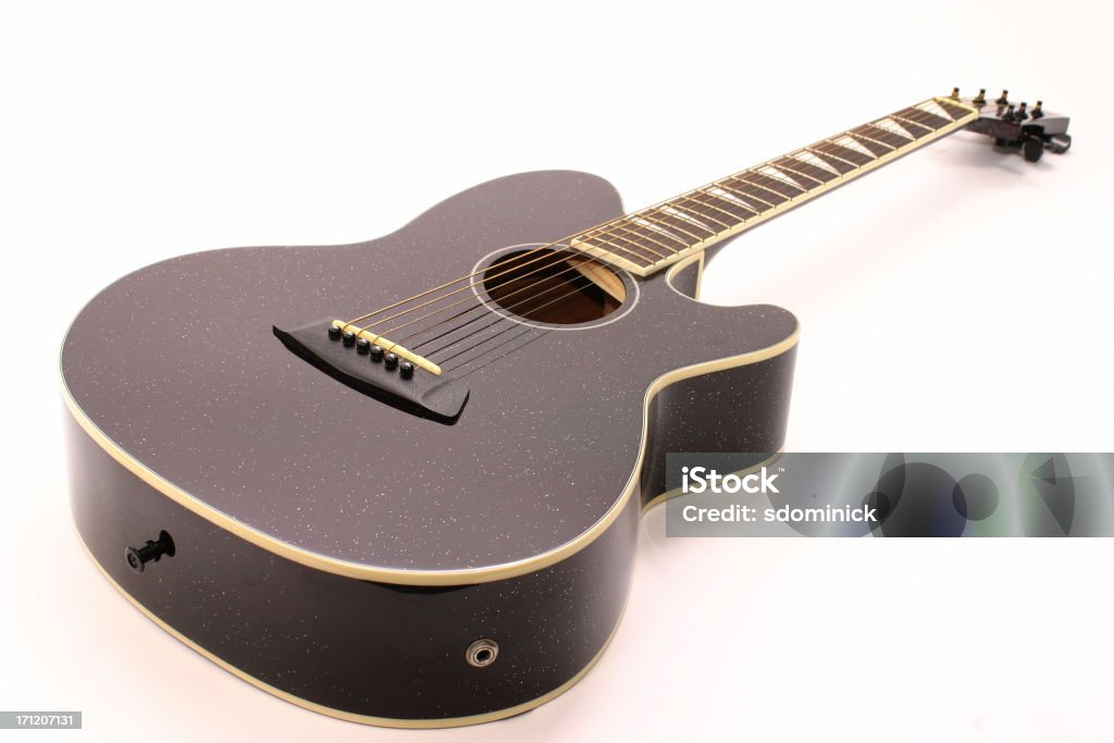 Isolated Acoustic Guitar Focus is on the body of the instrument. Acoustic Guitar Stock Photo