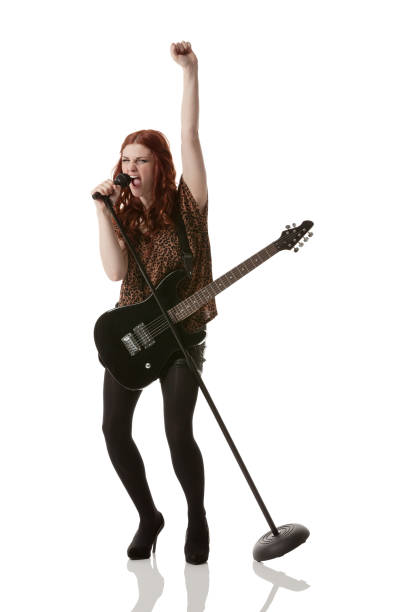 istock Female musician singing into a microphone 171207148