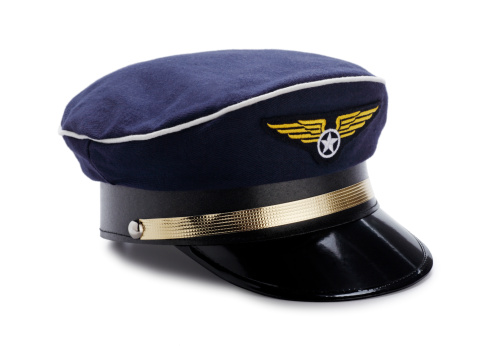 This is a photo of a blue Pilot's hat isolated on a white background with a drop shadow.