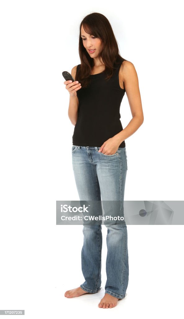 pretty brunette - Mobile Phone "pretty brunette using mobile phone, texting, sms, calling isolated on white" Beautiful People Stock Photo