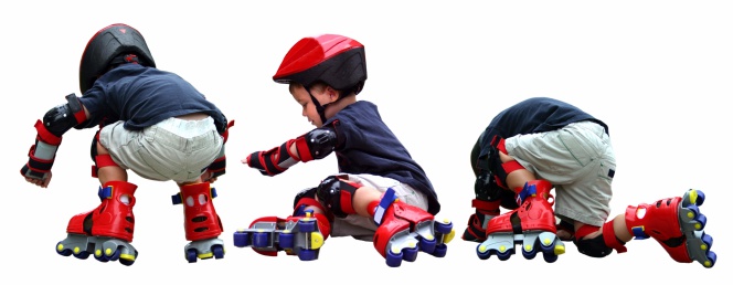 A little boy getting up after falling while practicing rollerblading.You may also like these: