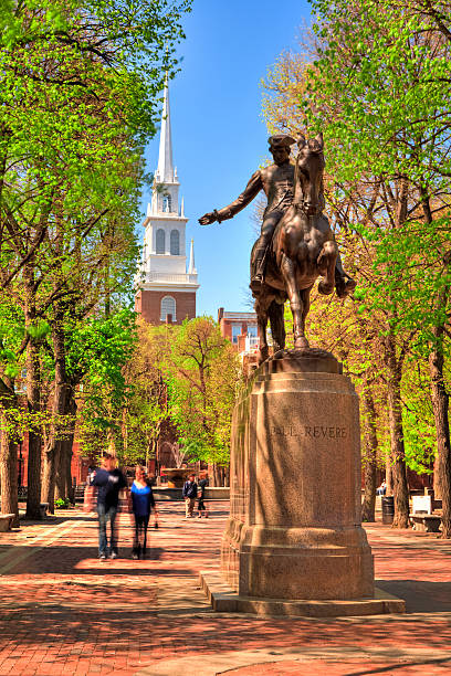 Paul Revere Statue in Boston, Massachusetts Statue of Paul Revere outside the Old North Church in the North End of Boston north end boston photos stock pictures, royalty-free photos & images