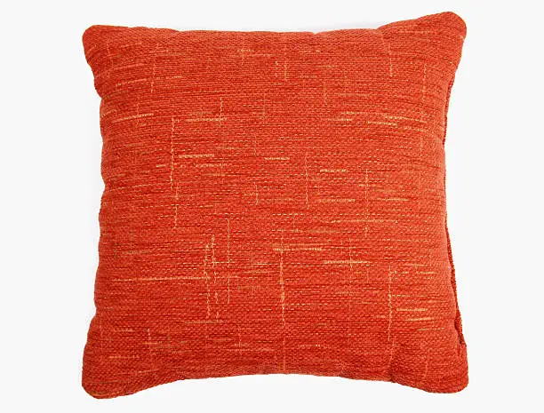 Photo of Red-orange square couch pillow with yellow design 