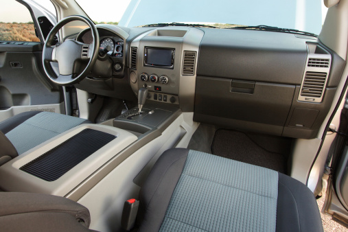 Spacious interior of an SUV or full size truck. Choose another iStock image to place in the monitor at the center of the dash! Canon 20D, 10-22mm lens, flash.