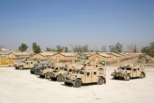 A lineup of humvees near camp ready to go out on a convoy.