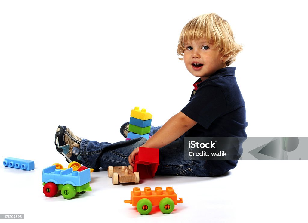 Child and his toys 2 years old child playing with his toys Boys Stock Photo