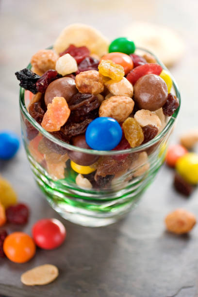 istock Clear glass dish containing trail mix with some spilled out 171210245