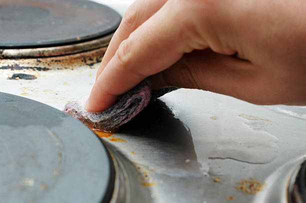 istock hand cleaning dirty kitchen oven hob 171211032