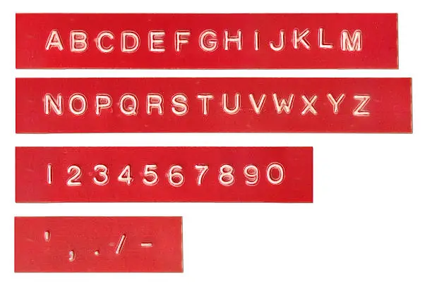 Stamped characters on labels. Includes alphabet, numbers and some symbols.